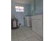 Functional laundry room with washer, dryer and water heater at 317 E Green St, Englewood, FL 34223