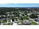 Wide aerial view of houses near the coast on a sunny day at 317 E Green St, Englewood, FL 34223