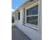 Home exterior featuring window with hurricane shutters at 317 E Green St, Englewood, FL 34223