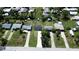 Aerial view of residential neighborhood with single-Gathering homes and lush landscaping at 317 E Green St, Englewood, FL 34223