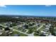 Wide aerial view of houses near the coast on a sunny day at 317 E Green St, Englewood, FL 34223