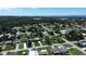 Aerial view showing home's location in residential area at 317 E Green St, Englewood, FL 34223