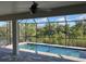 Enjoy this refreshing screened pool with tranquil views at 13342 Commonwealth Ave, Port Charlotte, FL 33981
