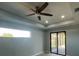 Bright bedroom with sliding glass doors to patio and water view at 13342 Commonwealth Ave, Port Charlotte, FL 33981