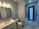 Modern bathroom with single vanity, toilet, and bathtub at 13342 Commonwealth Ave, Port Charlotte, FL 33981