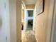 Bright hallway with tile floor and access to other rooms at 324 Santurce Ave, North Port, FL 34287