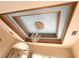 Beautiful tray ceiling with painted clouds and chandelier at 324 Santurce Ave, North Port, FL 34287