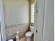 Convenient half bathroom with toilet and small sink at 324 Santurce Ave, North Port, FL 34287