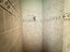 Simple shower with beige tile surround at 324 Santurce Ave, North Port, FL 34287