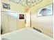 Bright bedroom with double doors and unique ceiling decor at 324 Santurce Ave, North Port, FL 34287