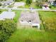 Aerial view of house back, showing a large backyard and patio at 324 Santurce Ave, North Port, FL 34287