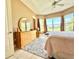 Spacious main bedroom with ample natural light and views of the backyard at 324 Santurce Ave, North Port, FL 34287