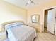 Bedroom with double bed, ceiling fan, and ensuite bathroom at 324 Santurce Ave, North Port, FL 34287