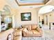 Spacious living room with leather couches and decorative ceiling at 324 Santurce Ave, North Port, FL 34287