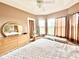 Main bedroom with large windows, ceiling fan, and built-in wardrobe at 324 Santurce Ave, North Port, FL 34287