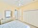 Bedroom with double bed, ceiling fan, and double door closet at 324 Santurce Ave, North Port, FL 34287