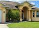 Beautiful two-story home with a manicured lawn and covered entryway at 324 Santurce Ave, North Port, FL 34287