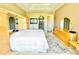 Main bedroom with large windows, ceiling fan, and ensuite bathroom at 324 Santurce Ave, North Port, FL 34287