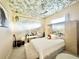 Bedroom with unique ceiling and large dresser at 324 Santurce Ave, North Port, FL 34287