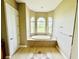Spa-like bathroom featuring a large garden tub and shower at 324 Santurce Ave, North Port, FL 34287