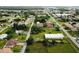 Aerial view of residential neighborhood with various houses and lots at 324 Santurce Ave, North Port, FL 34287