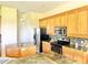 Spacious kitchen with wood cabinets, granite countertops, and stainless steel appliances at 324 Santurce Ave, North Port, FL 34287