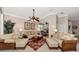 Open concept living room with a view of the kitchen and access to other areas of the home at 3363 Grand Vista Ct # 203, Port Charlotte, FL 33953