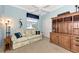 Bright office with built-in shelving and comfortable sofa at 3363 Grand Vista Ct # 203, Port Charlotte, FL 33953