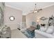 Open living area with a loft, comfy seating and a ceiling fan at 3363 Grand Vista Ct # 203, Port Charlotte, FL 33953