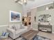 Bright living area with coastal-themed art and a comfortable couch at 3363 Grand Vista Ct # 203, Port Charlotte, FL 33953