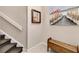 Staircase with wooden bench and coastal-themed wall art at 3363 Grand Vista Ct # 203, Port Charlotte, FL 33953