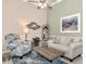 Living room with coastal decor, comfy seating, and a ceiling fan at 3363 Grand Vista Ct # 203, Port Charlotte, FL 33953