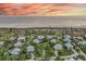 Aerial view of the house, highlighting its location near the beach in a upscale community at 22 Seawatch Dr, Boca Grande, FL 33921