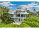 Elevated home with large deck and beautiful landscaping at 22 Seawatch Dr, Boca Grande, FL 33921