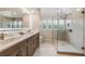 Modern bathroom with double vanity, frameless shower, and designer tile at 22 Seawatch Dr, Boca Grande, FL 33921