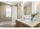 Updated bathroom with a modern vanity and a large mirror at 22 Seawatch Dr, Boca Grande, FL 33921