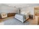 Serene bedroom with a queen-size bed and access to a nearby bathroom at 22 Seawatch Dr, Boca Grande, FL 33921