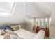 Cozy bedroom with a queen bed, skylight, and ocean views at 22 Seawatch Dr, Boca Grande, FL 33921