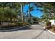 Gated community entrance with lush landscaping and security at 22 Seawatch Dr, Boca Grande, FL 33921