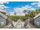 Private deck overlooking the beach with two white chairs and a side table at 22 Seawatch Dr, Boca Grande, FL 33921