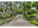 Brick driveway lined with lush landscaping at 22 Seawatch Dr, Boca Grande, FL 33921