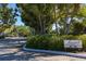 Seawatch Lakeside community entrance with paved road and lush landscaping at 22 Seawatch Dr, Boca Grande, FL 33921