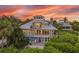 Two-story beach house at sunset at 22 Seawatch Dr, Boca Grande, FL 33921