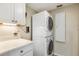 Convenient laundry room with stackable washer and dryer at 22 Seawatch Dr, Boca Grande, FL 33921