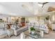 Bright living room featuring a sectional sofa, glass coffee table and hardwood floors at 22 Seawatch Dr, Boca Grande, FL 33921