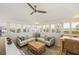 Bright living room with ocean views, comfy seating, and a convenient workspace at 22 Seawatch Dr, Boca Grande, FL 33921