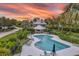 Community pool and patio area with sunset views at 22 Seawatch Dr, Boca Grande, FL 33921