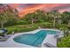 Stunning sunset view over the community pool area at 22 Seawatch Dr, Boca Grande, FL 33921