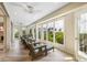 Bright sunroom with ocean views and comfortable seating at 22 Seawatch Dr, Boca Grande, FL 33921