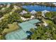 Two well-maintained tennis courts, surrounded by lush landscaping at 22 Seawatch Dr, Boca Grande, FL 33921